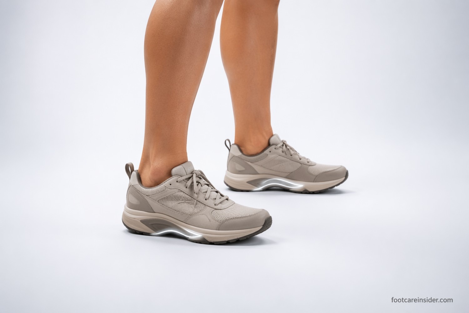 Adult standing in supportive shoes with structured arch-support insoles, illustrating how arch support height and design can influence comfort, pressure distribution, and foot support during daily activities.